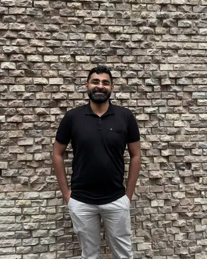 Rahul Sengupta, SEO and AI-search consultant, standing full-length and smiling